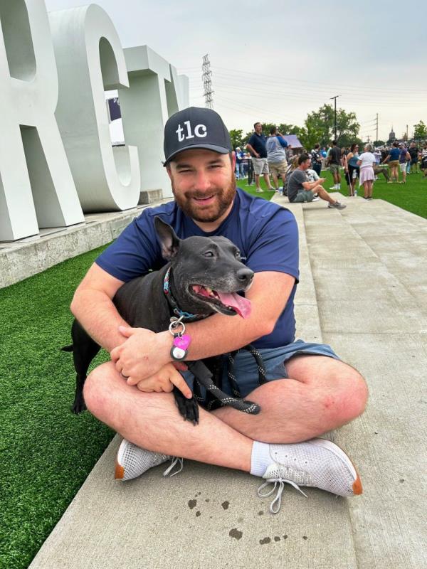 Blake Gober holding a dog