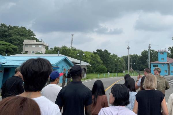 Travis King with civilians on a tour of the demilitarized zone. 