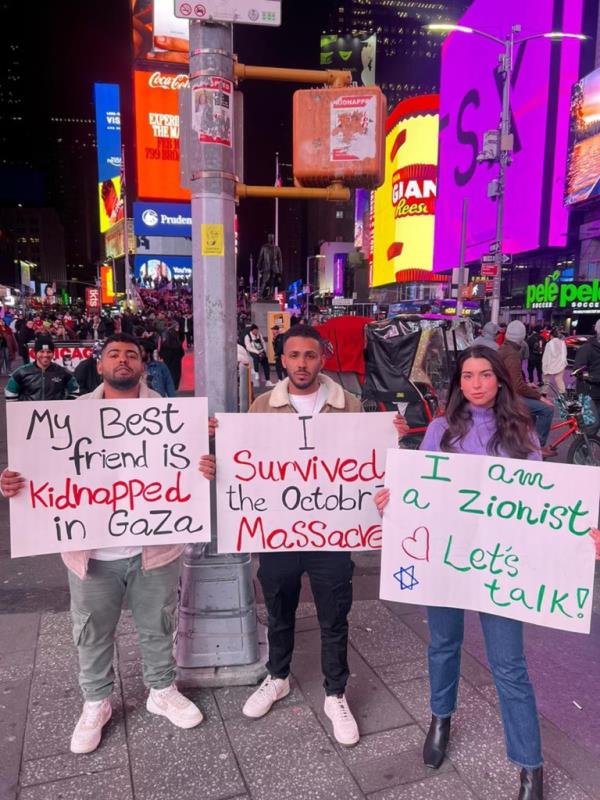 The brothers were holding signs reading, 