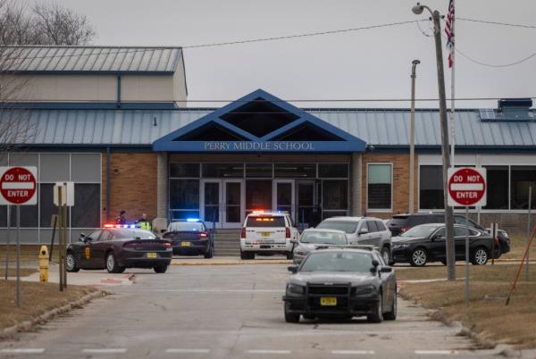 Police officers secure the campus at Perry Middle and High School during a shooting situation in Perry, Iowa, on January 4, 2024.