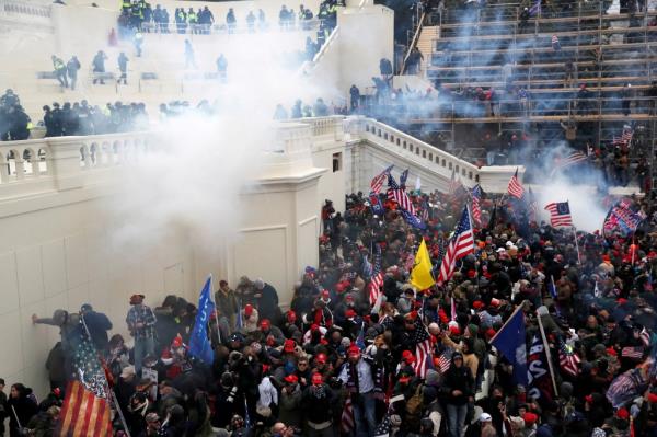 Police release tear gas into a crowd of pro-Trump protesters during clashes at a rally to co<em></em>ntest the certification of the 2020 U.S. presidential election results.