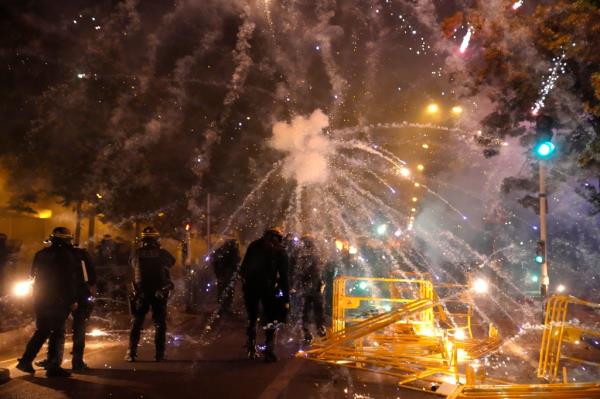 Multiple vehicles were set ablaze in Nanterre and protesters shot fireworks and threw sto<em></em>nes at police, who fired repeated volleys of tear gas.