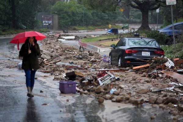 Mud and debris is strewn on Fryman Rd. during a rain storm