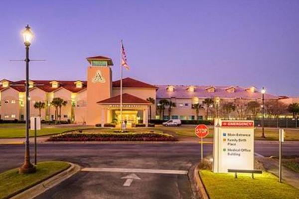 Ascension Sacred Heart Emerald Coast hospital building with a flag and sign