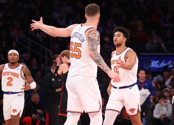 Knicks guard Quentin Grimes (6) is co<em></em>ngratulated by his teammates after one of many of his successful three point shots