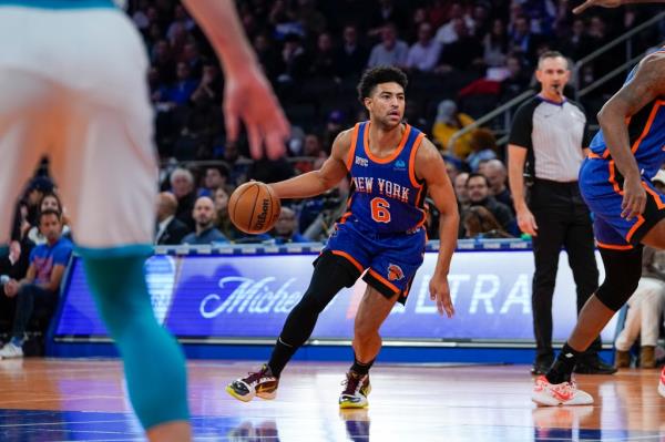 Knicks guard Quentin Grimes (6) handles the ball during the first half of an NBA basketball game against the Charlotte Hornets