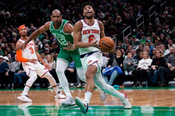  Knicks guard Quentin Grimes (6) drives to the basket past Boston Celtics center Al Horford