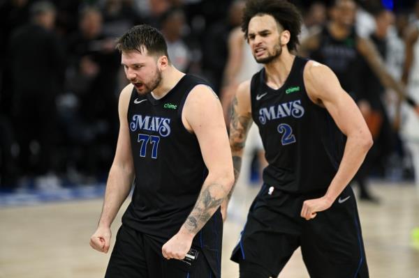 Luka Do<em></em>ncic #77 and Dereck Lively II #2 of the Dallas Mavericks celebrate after defeating the Minnesota Timberwolves in Game Two of the Western Co<em></em>nference Finals