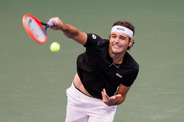 Taylor Fritz serving against Jannik Sinner during the Men's Champio<em></em>nship match at the 2024 US Open Championships