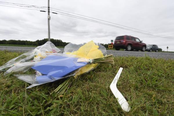 A makeshift memorial for Columbus Blue Jackets hockey player Johnny Gaudreau and his brother at the intersection of Pennsville Auburn Road and Stumpy Lane in Pendricktown.