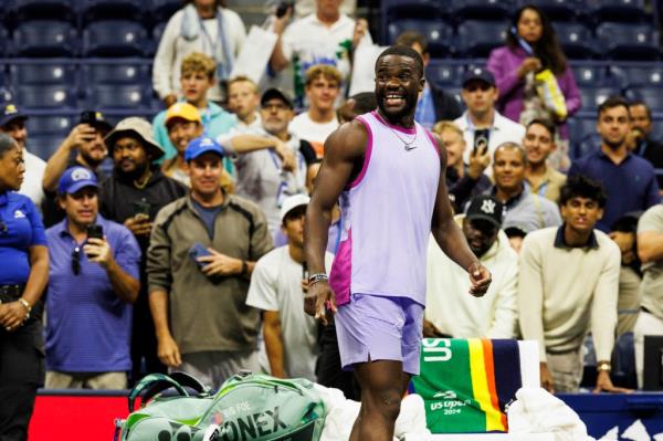 Frances Tiafoe of USA reacts after winning the match when Grigor Dimitrov of Bulgaria withdrew in their Menas Singles quarterfinal match at the 2024 US Open Champio<em></em>nships played in the USTA Billie Jean King Tennis Center on September 3, 2024.