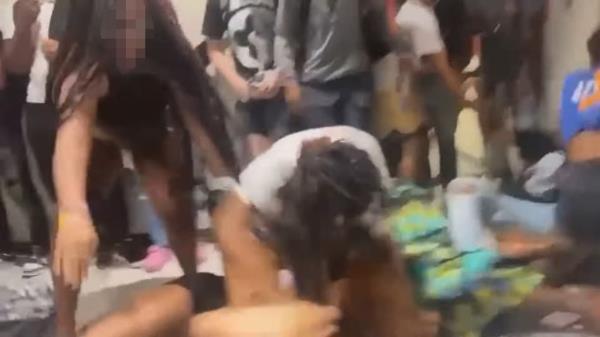 In another video, several female students punch and kick a defenseless peer who was lying on the ground.