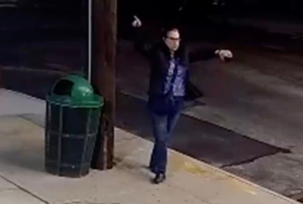 Bizarre surveillance video captured the woman dancing on the street before wandering off.