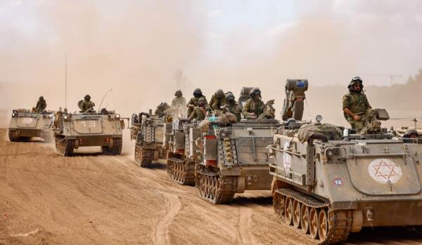 Israeli tanks and troops have been photographed statio<em></em>ned and ready to strike along the border of the Gaza Strip 