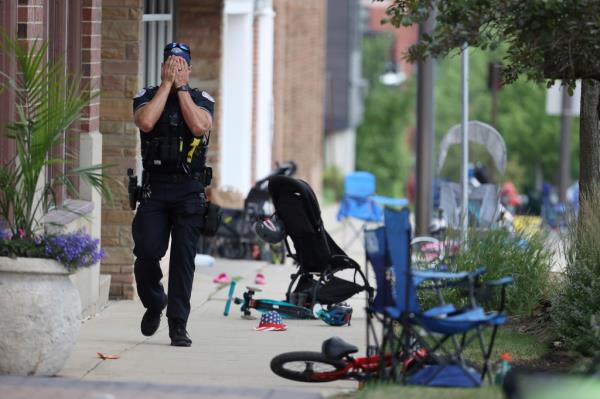 A cop seen distraught at the scene of the shooting.