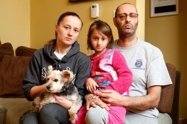 The Seths –Gosia, Guy, and Zoey — with their Yorkie, Coco.