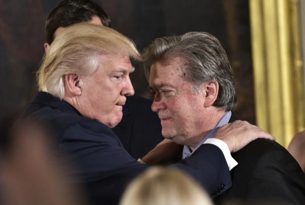 Trump and Bannon  during the swearing-in of senior staff in the East Room of the White House on Jan. 22, 2017 in Washington, DC. 