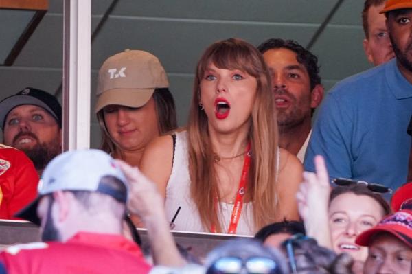 Taylor Swift and Travis Kelce, both 33, were hanging on each other Sunday after she cheered him at a Kansas City Chiefs game.