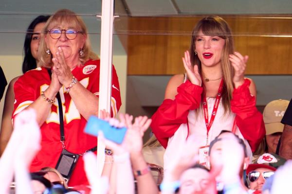 Swift cheers from a suite as the Kansas City Chiefs play the Chicago Bears at Arrowhead Stadium on Sept. 24.