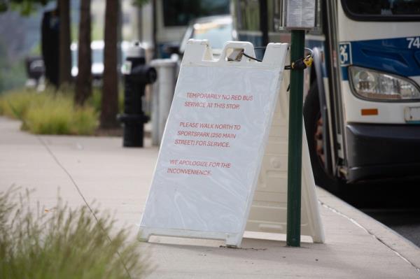 A sign saying there's no bus service at the stop.