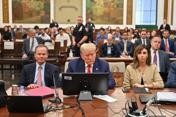 Former US President Do<em></em>nald Trump (C) attends the third day of his civil fraud trial in New York on October 4, 2023