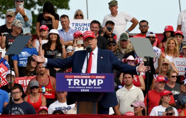 Former President Do<em></em>nald Trump speaking at a rally in Racine, Wisco<em></em>nsin on June 18, 2024.