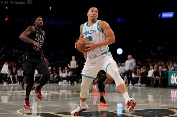 Grant Williams (2) drives to the basket against Brooklyn Nets forward Dorian Finney-Smith (28).