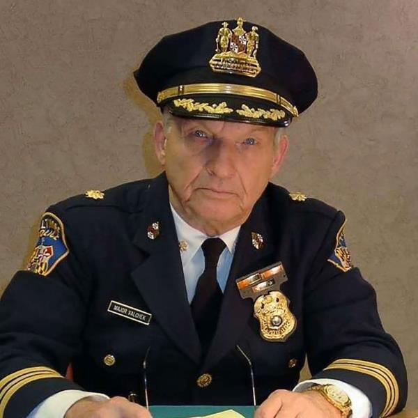 Al Brown in a cop uniform. 