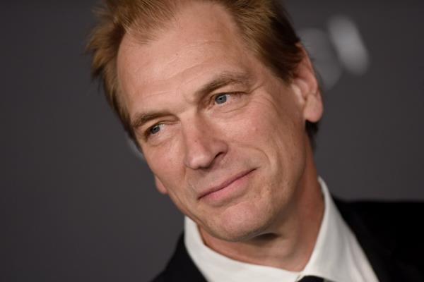 Julian Sands smiling. 