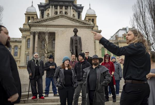 Members in front of the satanic temple.