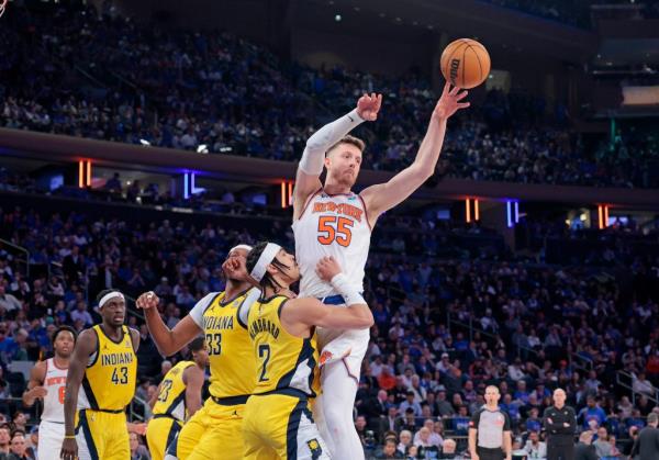 Knicks center Isaiah Hartenstein (55) passes the ball during Game 1 against the Pacers on Monday.