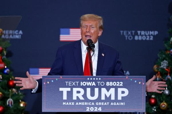 Former US President and 2024 presidential hopeful Do<em></em>nald Trump arrives to speak during a campaign event in Waterloo, Iowa, on December 19, 2023