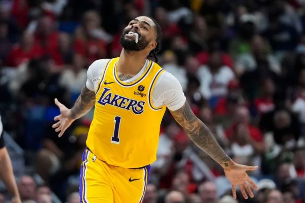 Lakers guard D'Angelo Russell (1) reacts after making a 3-point basket in the second half on Tuesday night.