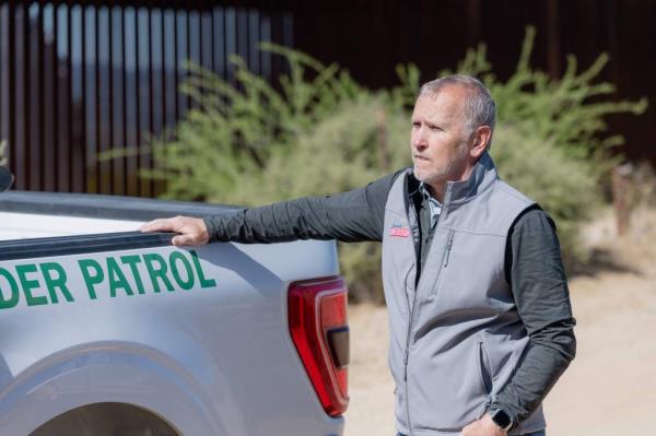 California co<em></em>ngressional candidate Matt Gunderson leaning on the back of a truck at the southern border on May 29, 2024