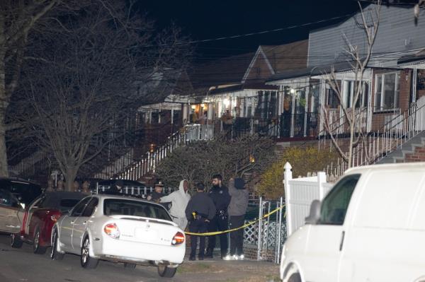 Police are seen at the scene of a fatal shooting at 1112 E 104 St. in Brooklyn,  Tuesday, March 19, 2024.  