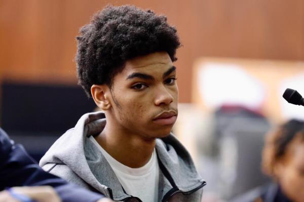 The 19-year-old teenager who allegedly shot a 16-year-old sitting in court.