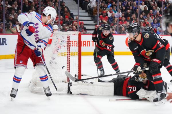  Alexis Lafreniere #13 of the New York Rangers scores a second period goal against Joo<em></em>nas Korpisalo #70 or the Senators.