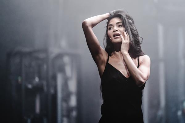 Nicole Scherzinger singing in a black dress