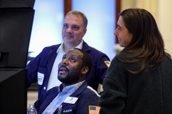 Traders work on the New York Stock Exchange.