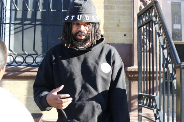 Rashad Pyatt, a 36-year-old building superintendent, looking unhappy in front of his building in the Bronx, New York, due to a fine issued by the city for alleged foul odor.