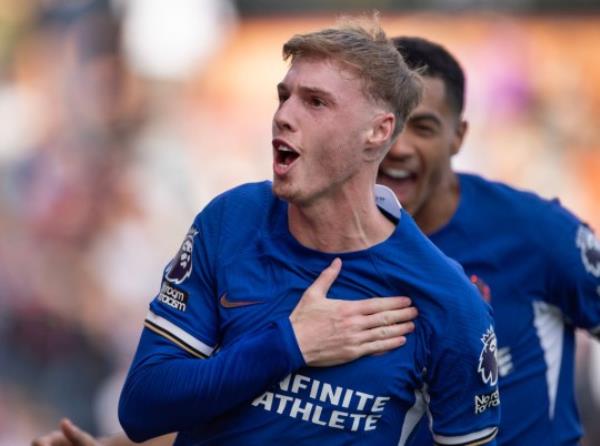 Cole Palmer celebrates scoring a goal for Chelsea