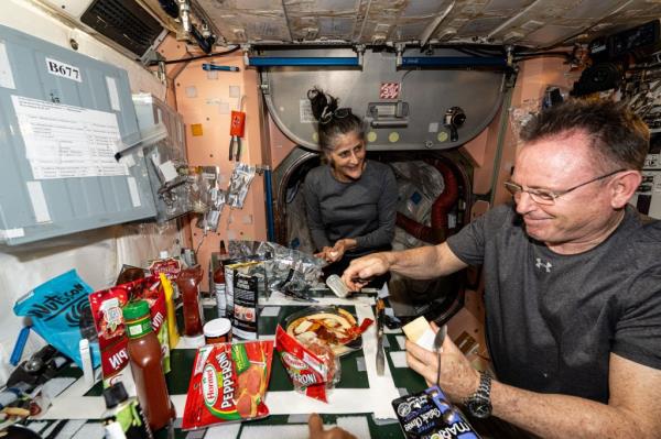 Butch Wilmore, 61, and Sunita Williams, 59, havin<em></em>g a meal on the Internatio<em></em>nal Space Station on Sept. 9, 2024.