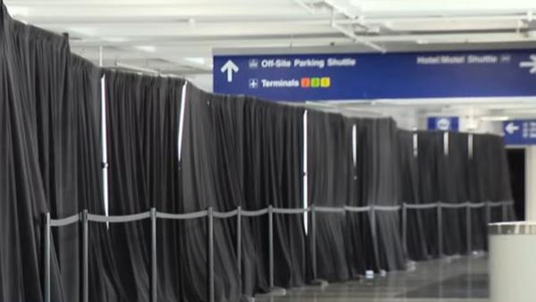 More than 400 migrants are reportedly being housed in a section of the airport, hidden from public view behind black curtains, up from 31 at the beginning of August. 