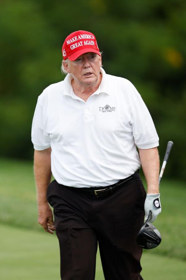 The familiar pose of Trump on the golf course