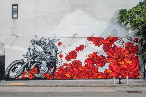 David Flores’s flowery, red mural of a motorcycle  on the Bowery wall. 