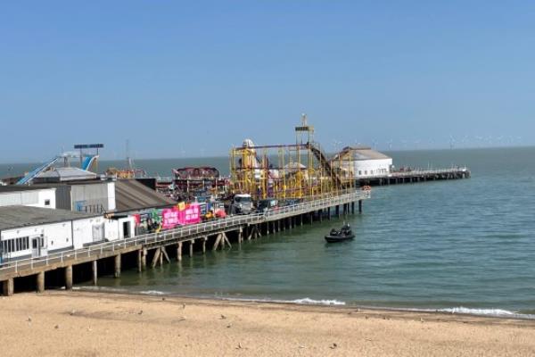 A boat next to Clacton Pier in Clacton-on-Sea, Essex.