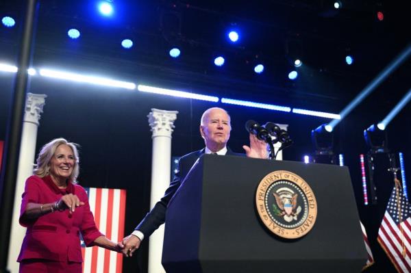 Joe Biden and Jill Biden exit the stage 