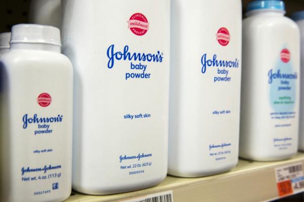 Bottles of Johnson & Johnson baby powder line a drugstore shelf in New York October 15, 2015.  