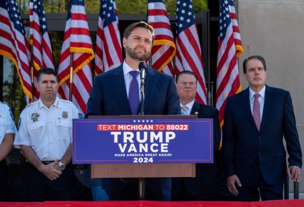 Vice-presidential nominee Senator JD Vance addresses media members outside the Shelby Township Police Department on Wednesday, Aug. 7, 2024.