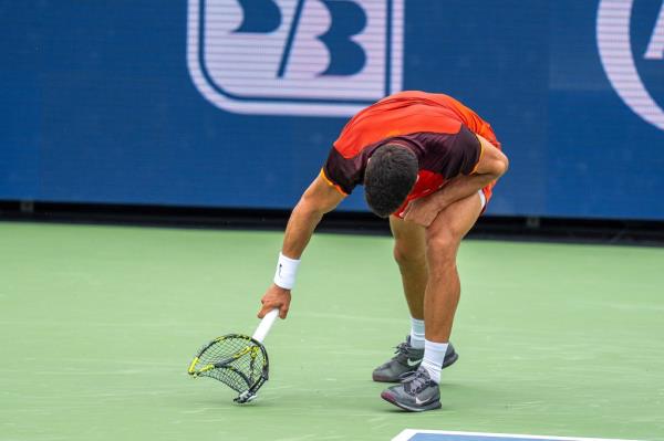 Carlos Alcaraz smashes his racket during an Aug. 16 loss at the Cincinnati Open.